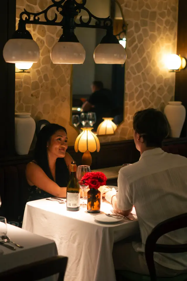 Couple enjoying an intimate dinner at Jard'Or in Nusa Dua, Bali