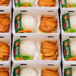 Ilustrasi tumpukan catering nasi box untuk gathering rombongan di Magelang