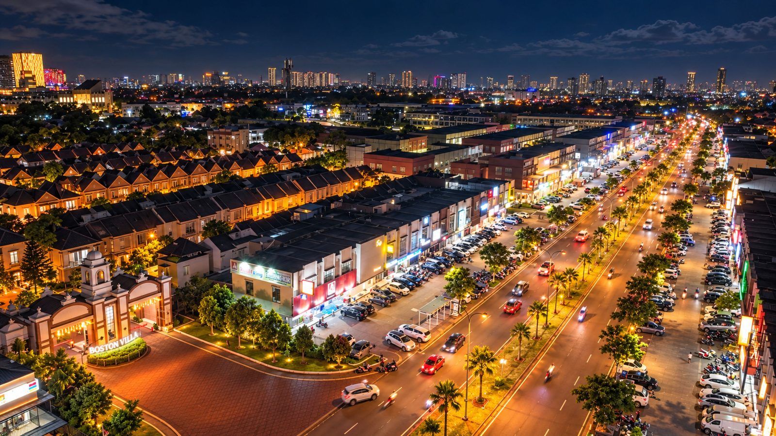 Suasana malam kawasan Gading Serpong dengan jalan raya dan deretan ruko terang